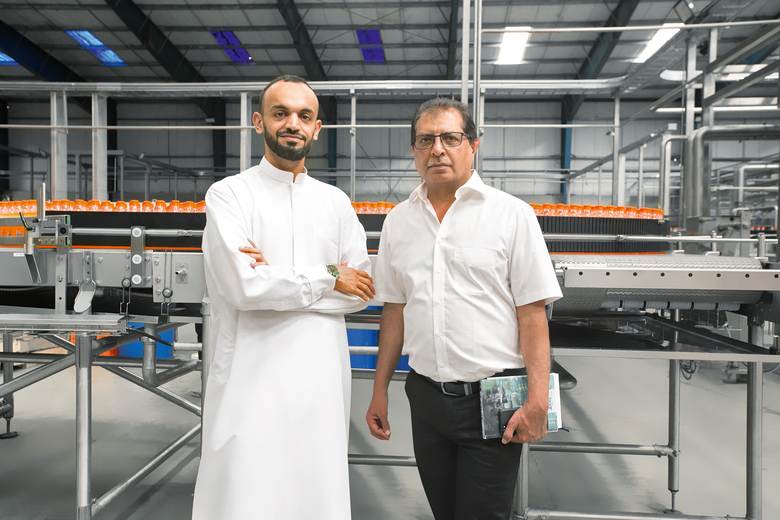 The chemistry's right: Salum Nahdi (left), director and CEO of Watercom, side by side with his contact at KHS, regional sales manager Dawood Hobaya.