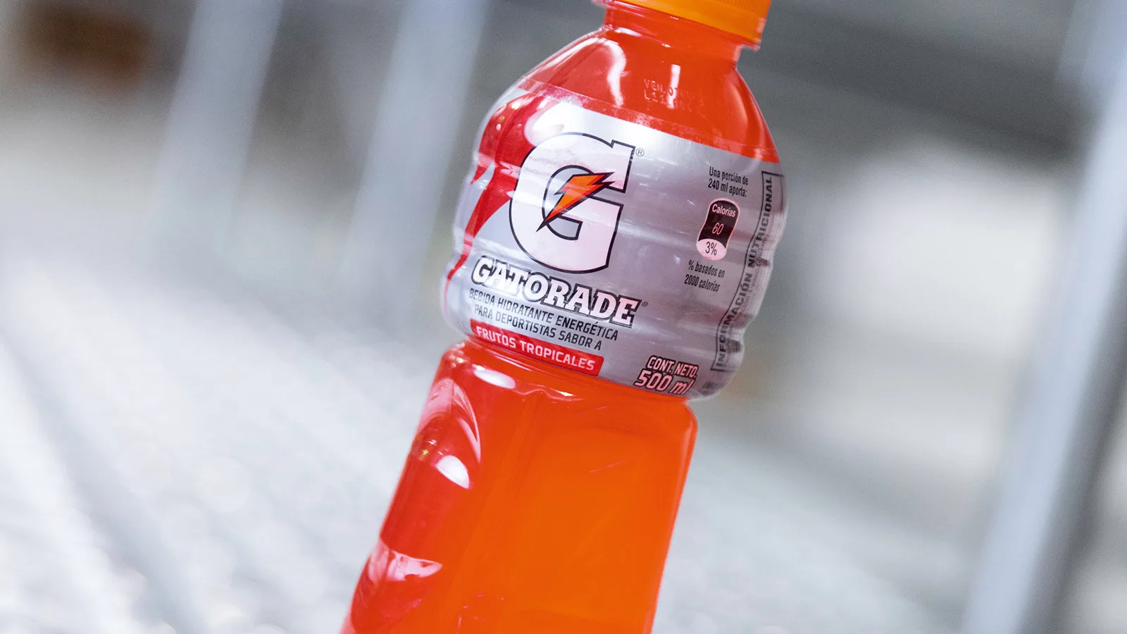 A bottle of orange liquid
